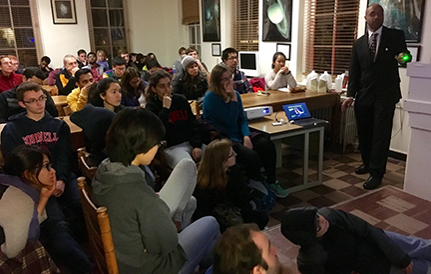 A lecture being given in a full Fuertes classroom